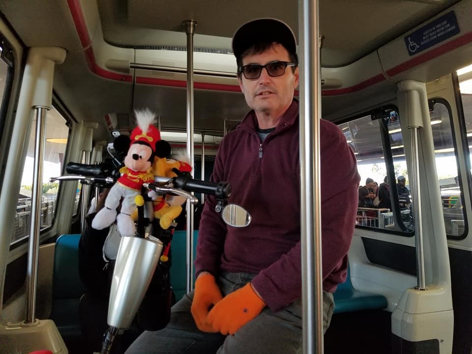 Chris in Monorail with Gloves and Triad scooter